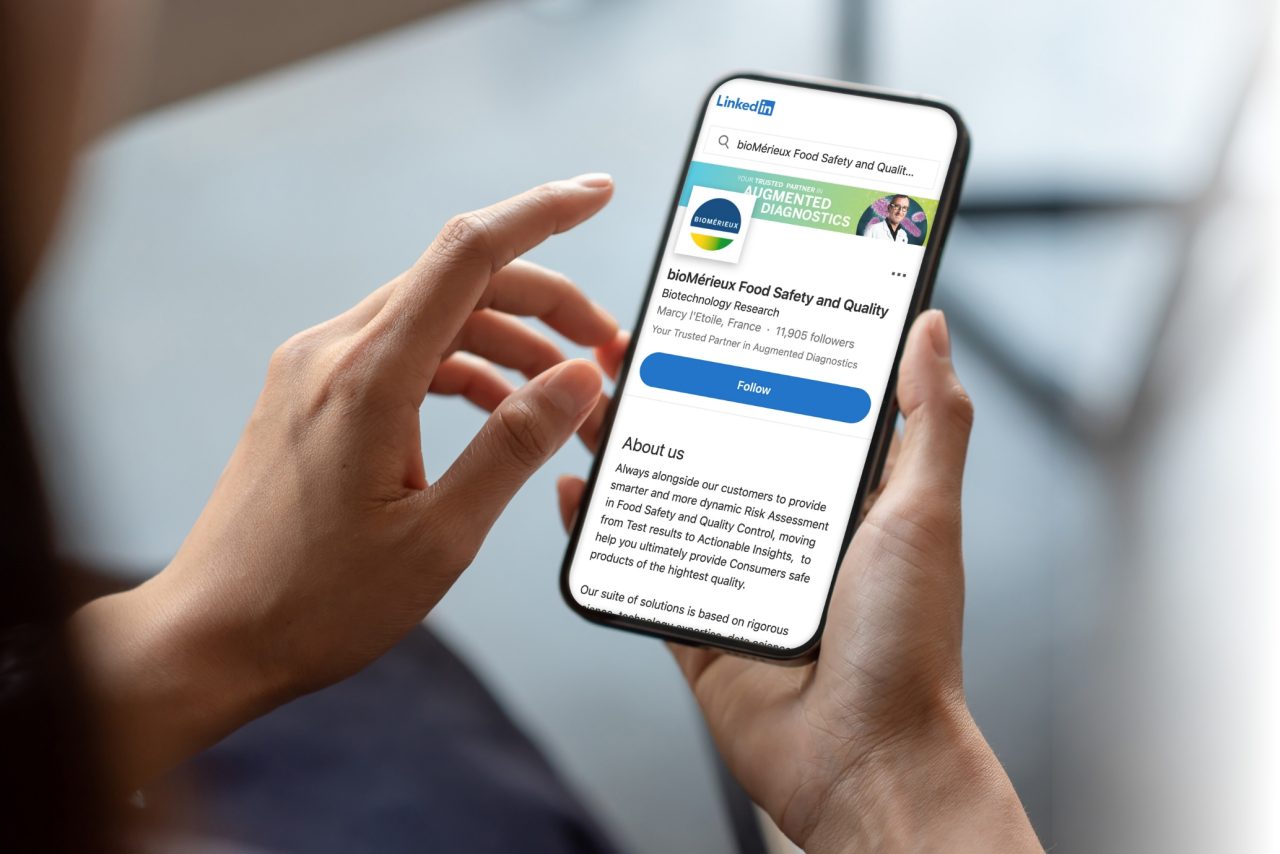 Person holding phone on bioMérieux's LinkedIn channel
