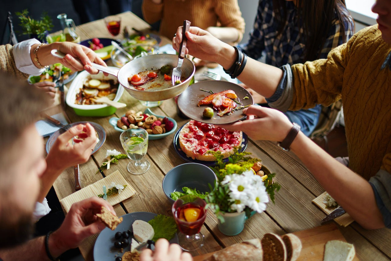 Family shares a meal together at a table 