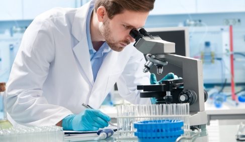 Man looking in microscope