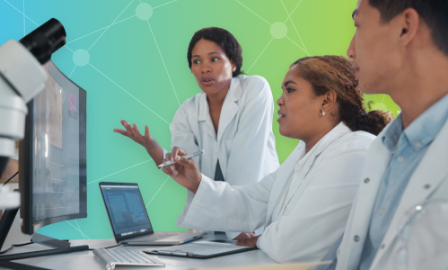 Group of lab technicians study results together